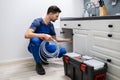 Plumber Cleaning Clogged Sink Pipe Royalty Free Stock Photo