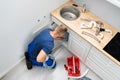 Plumber Cleaning Clogged Sink Pipe Royalty Free Stock Photo