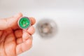 A plumber cleans a water purification filter in faucet faucets in a washbasin