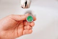 A plumber cleans a water purification filter in faucet faucets in a washbasin