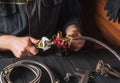 The plumber connects the brass fittings to the faucet with an adjustable wrench. Close-up of a foreman hand while working in a