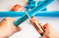 A plumber cut PVC pipe with PVC pipe cutting pliers tool .selective focus .Plumbing Repair and maintenance concept Royalty Free Stock Photo