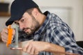 plumber cutting copper pipe with saw Royalty Free Stock Photo