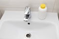 Plumber drain granules in White Plastic Bottle With Yellow Cap On Bathroom Sink In Shower