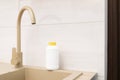 Plumber drain granules in White Plastic Bottle With Yellow Cap On Kitchen Sink In Cook