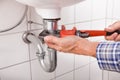 Plumber fitting sink pipe Royalty Free Stock Photo