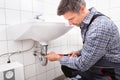 Plumber fitting sink pipe Royalty Free Stock Photo