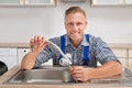 Plumber Fixing Faucet In Sink Royalty Free Stock Photo