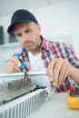 Plumber fixing a radiator