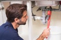 Plumber fixing under the sink Royalty Free Stock Photo