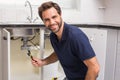 Plumber fixing under the sink Royalty Free Stock Photo