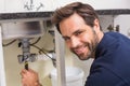 Plumber fixing under the sink Royalty Free Stock Photo