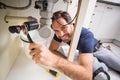 Plumber fixing under the sink Royalty Free Stock Photo