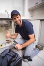 Plumber fixing under the sink Royalty Free Stock Photo