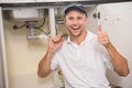 Plumber fixing under the sink Royalty Free Stock Photo