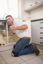 Plumber fixing under the sink Royalty Free Stock Photo