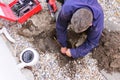 Plumber fixing an underground hot water pipe leaking with a tools Royalty Free Stock Photo