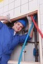 Plumber fixing water supply Royalty Free Stock Photo