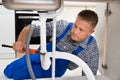 Plumber Fixing White Sink Pipe Royalty Free Stock Photo