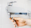 Plumber hands fixing shower mixer Royalty Free Stock Photo