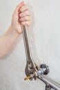 Plumber hands fixing water valve tap using plumbers adjustable w Royalty Free Stock Photo