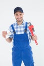 Plumber holding adjustable wrench and sink pipe Royalty Free Stock Photo