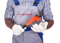 Plumber holding pipe wrench