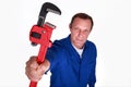 Plumber holding wrench Royalty Free Stock Photo