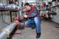 Plumber Installing Heating System Boiler Room Royalty Free Stock Photo