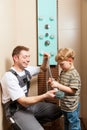 Plumber installing a mixer tap in a bathroom Royalty Free Stock Photo