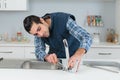 Plumber installing tap Royalty Free Stock Photo