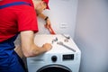 Plumber installing washing machine