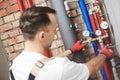 Plumber installing water equipment - meter, filter and pressure reducer Royalty Free Stock Photo