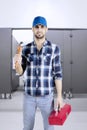 Plumber man standing in the toilet Royalty Free Stock Photo