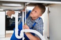 Plumber Measuring Sink Pipe Royalty Free Stock Photo