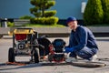 The plumber with portable camera for pipe inspection and other plumbing work