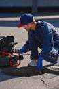 The plumber with portable camera for pipe inspection and other plumbing work