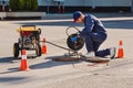 Plumber prepares to fix the problem in the sewer. Repair work on troubleshooting