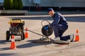 The plumber prepares to fix the problem in the sewer. Repair work on troubleshooting Royalty Free Stock Photo