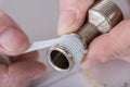 Plumber putting a teflon joint on a thread Royalty Free Stock Photo