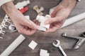 Plumber putting a teflon tape. Repair of water pipes Royalty Free Stock Photo