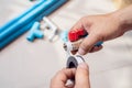 Plumber putting teflon thread tape on the thread , Preparing to connect to PVC Pipe at home Royalty Free Stock Photo