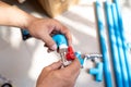 Plumber putting teflon thread tape on the thread , Preparing to connect to PVC Pipe at home Royalty Free Stock Photo