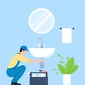 Plumber repair sink in bathroom. Professional plumbers service, handyman with tools work with pipes. Domestic renovation
