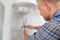 Plumber Repairing Electric Boiler Royalty Free Stock Photo