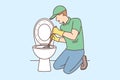 Plumber is repairing toilet bowl using plunger to clean pipes after clogged sewer