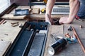 Plumber repairs pipeline in the floor, replaces the old pipes with new copper, screwdriver, gas burner, soldering, construction Royalty Free Stock Photo