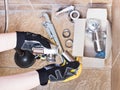 Plumber replaces chrome plated trap of sink Royalty Free Stock Photo