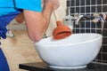 Plumber with rubber plunger Royalty Free Stock Photo