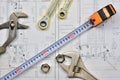 Plumber`s tools on an architectural plan of a house Royalty Free Stock Photo